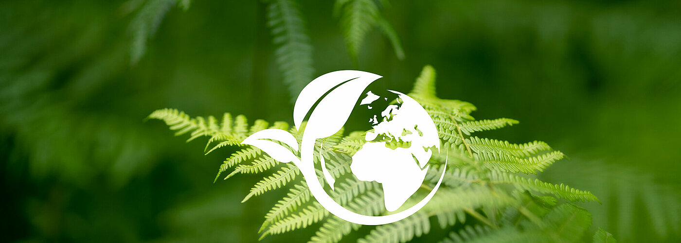 Green foliage with environmental symbol - SIKO GmbH's sustainability concept