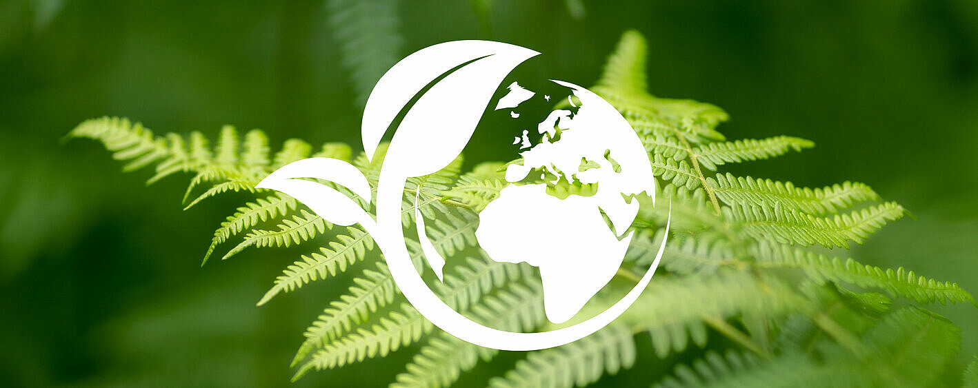 Green foliage with environmental symbol - SIKO GmbH's sustainability concept