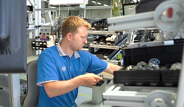 SIKO employees in electronics manufacturing at work