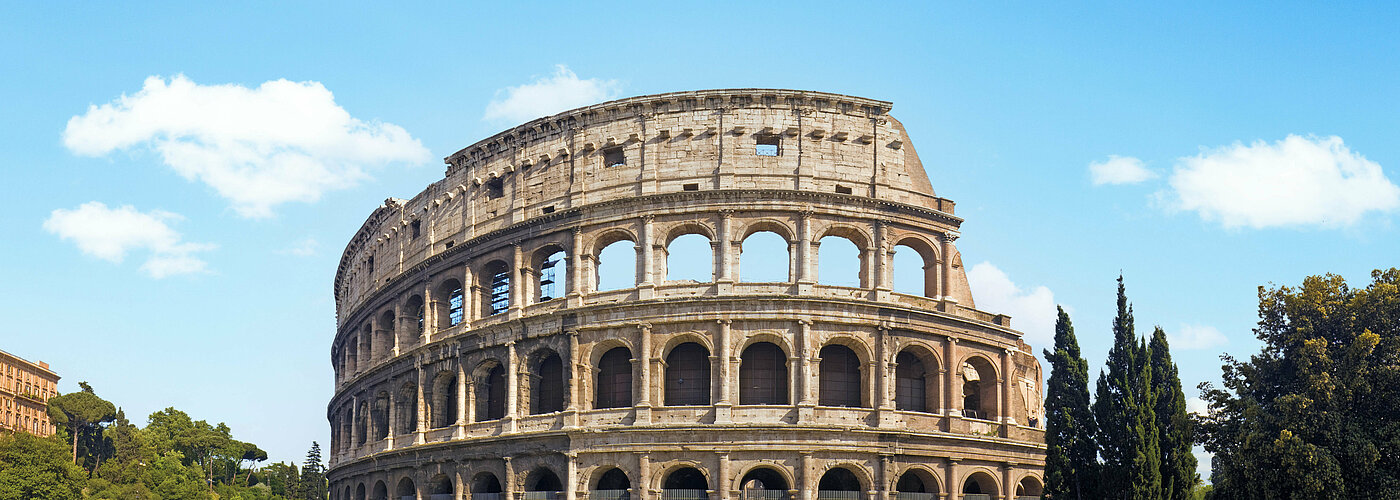 The Colosseum in Rome, Italy, with blue sky